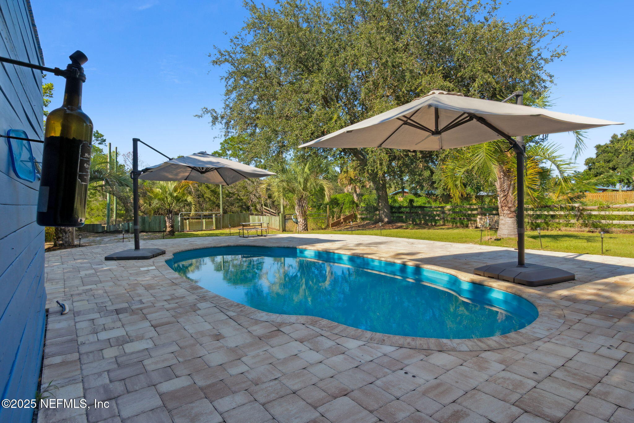 16199 Shellcracker Road Jacksonville, FL 32226 - Photo 38 of 40 a view of a swimming pool with a bench in the patio