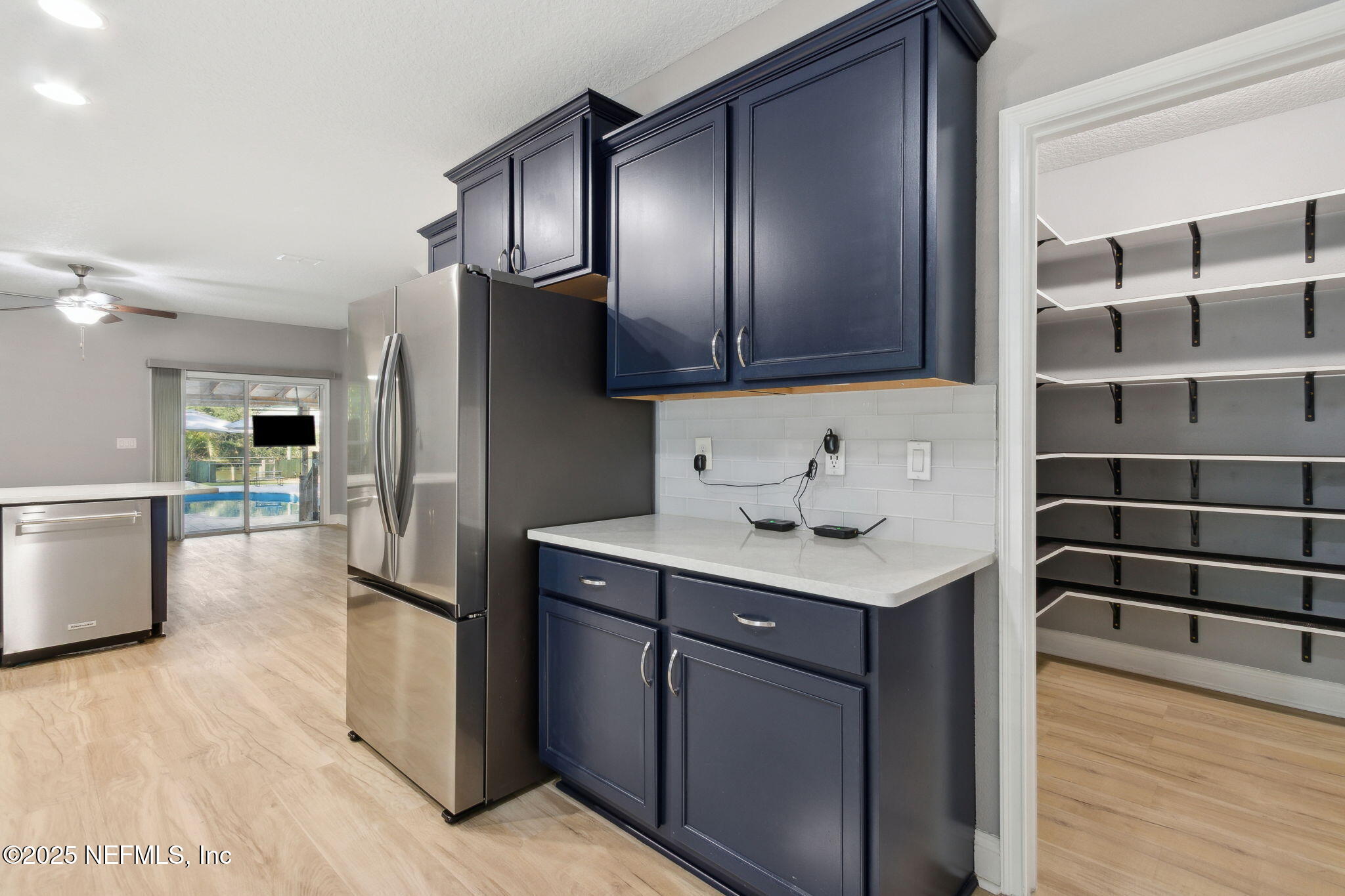 16199 Shellcracker Road Jacksonville, FL 32226 - Photo 9 of 40 a kitchen with stainless steel appliances granite countertop a sink a stove and a refrigerator
