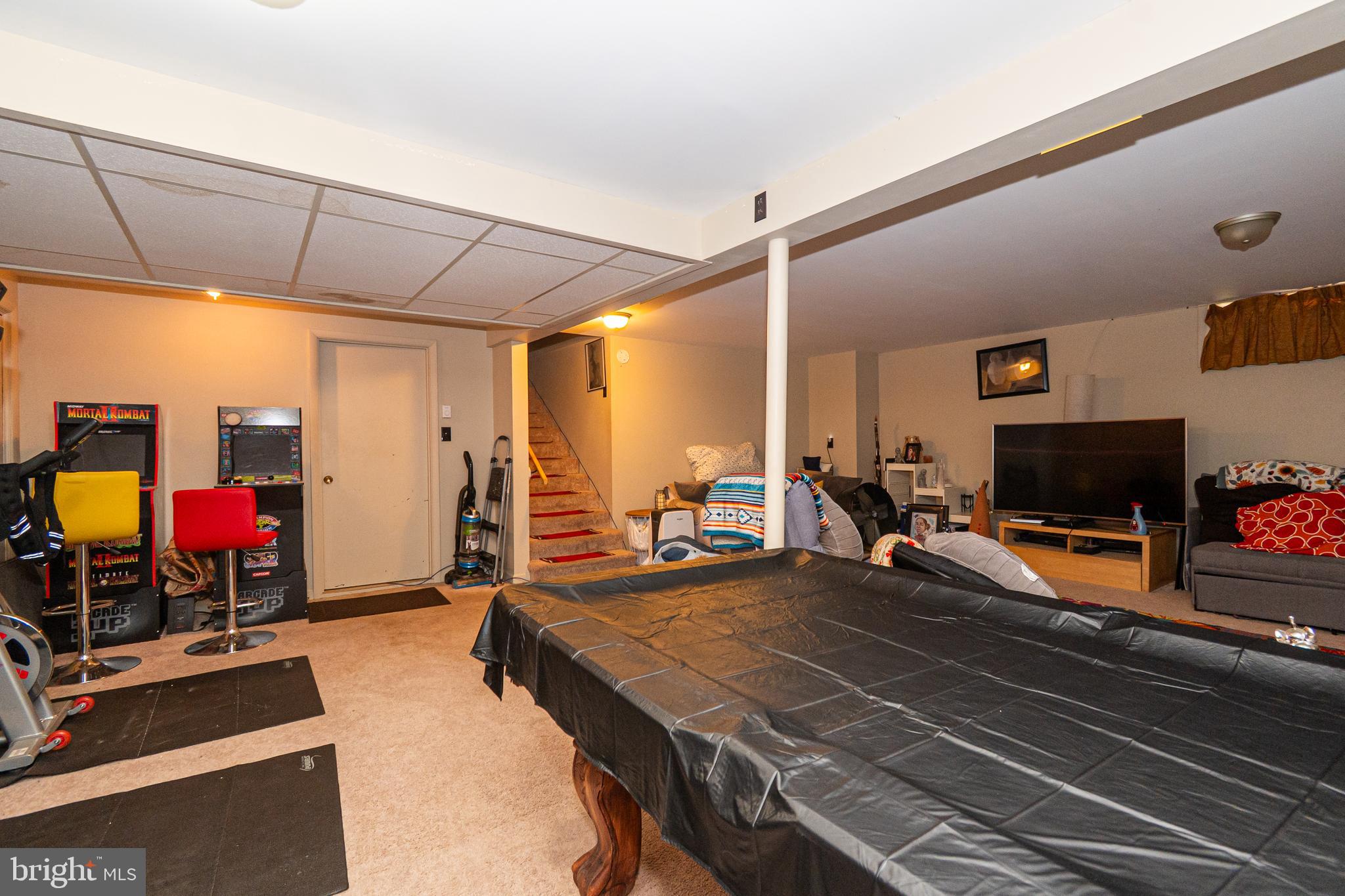 16308 Brandywine Road Brandywine, MD 20613 - Photo 12 of 27 a bedroom with furniture and a flat screen tv