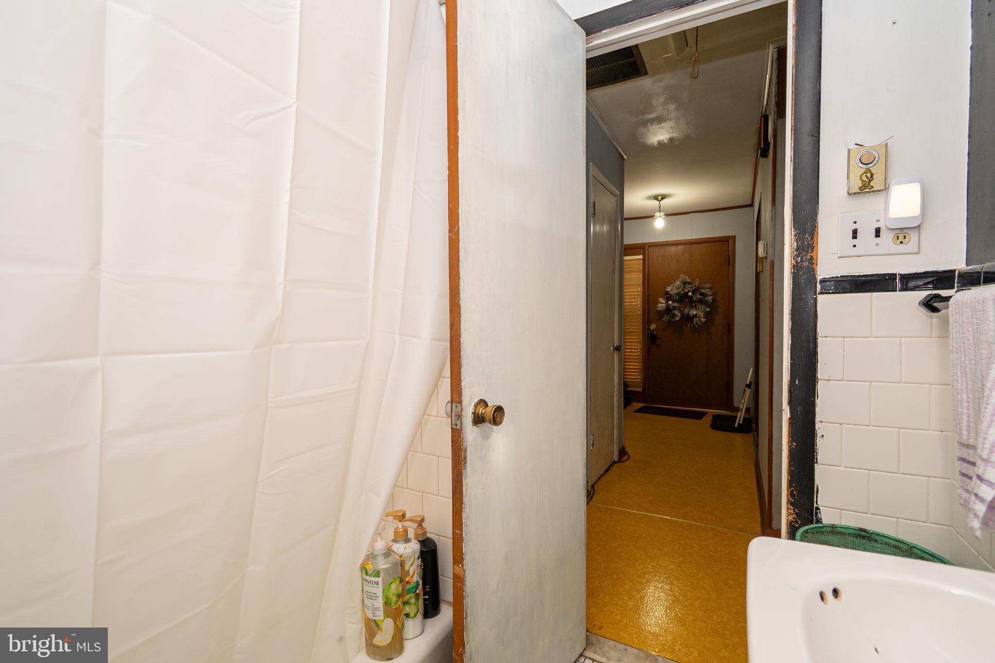 16308 Brandywine Road Brandywine, MD 20613 - Photo 22 of 27 a bathroom with a tub and a shower