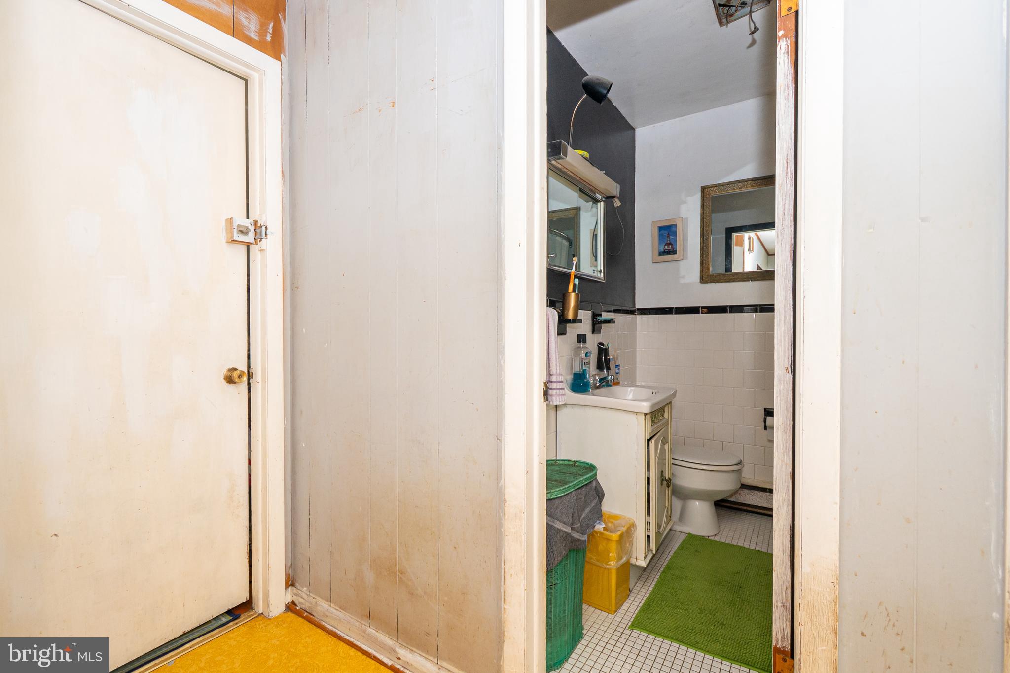 16308 Brandywine Road Brandywine, MD 20613 - Photo 23 of 27 a bathroom with a toilet and a shower curtain