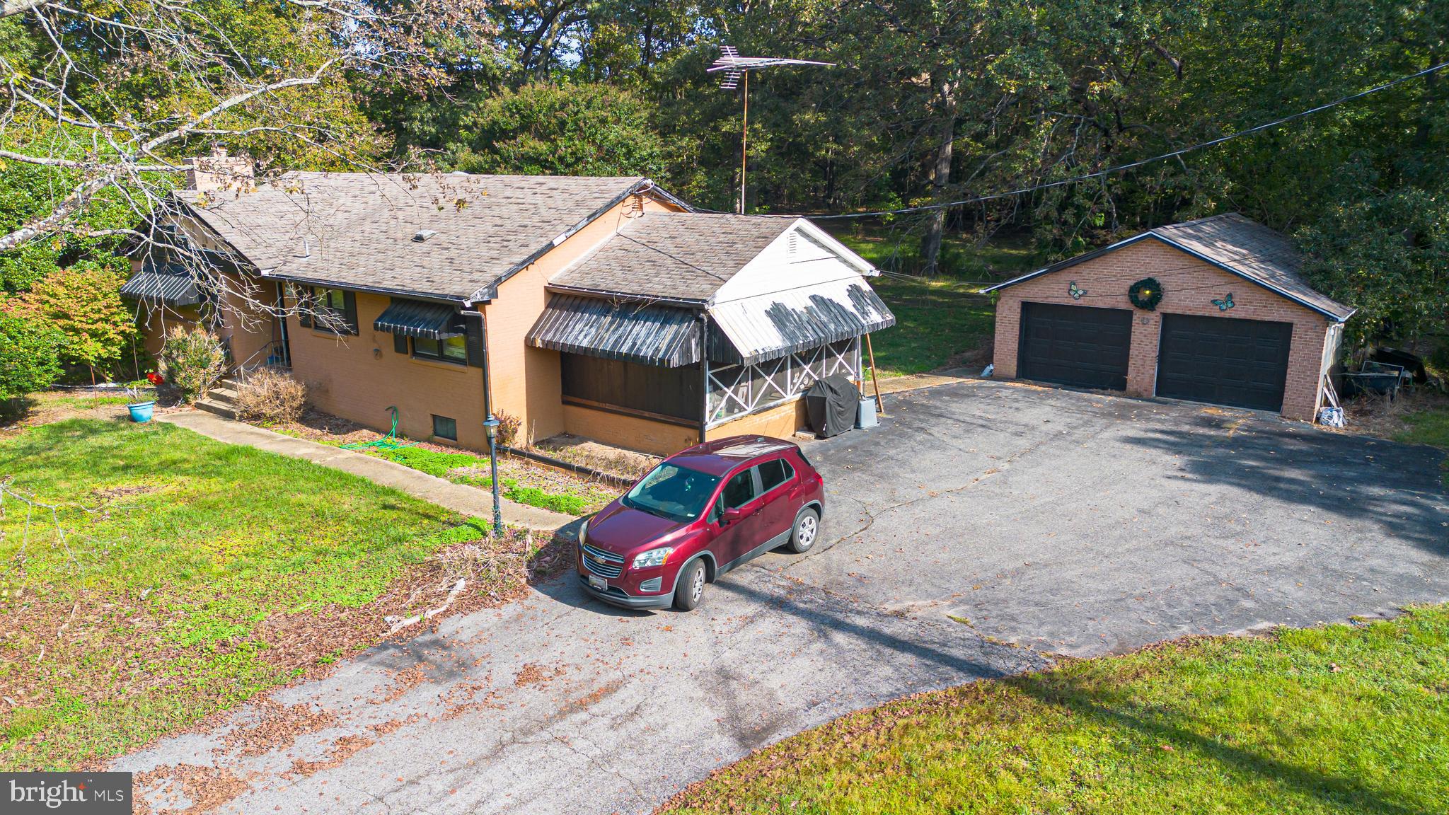 16308 Brandywine Road Brandywine, MD 20613 - Photo 26 of 27 an aerial view of a house with backyard space and balcony