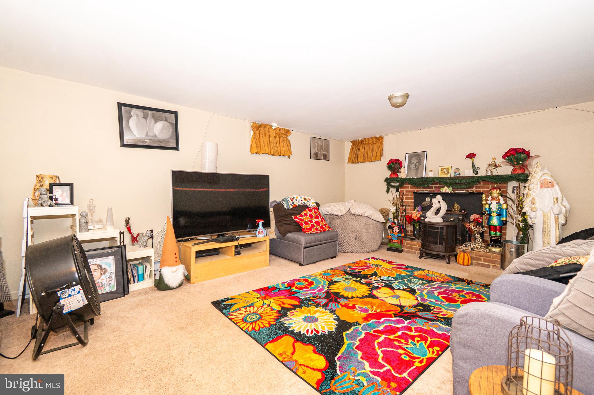 16308 Brandywine Road Brandywine, MD 20613 - Photo 9 of 27 a bedroom with furniture and a flat screen tv