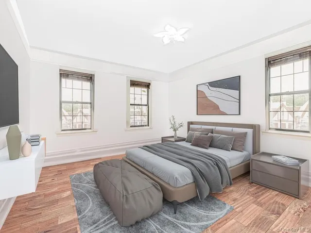 a bedroom with double bed and a window