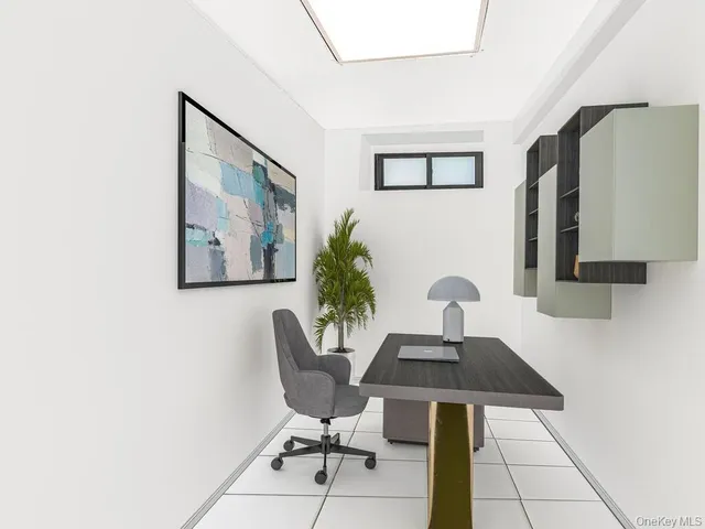 a view of a workspace with furniture