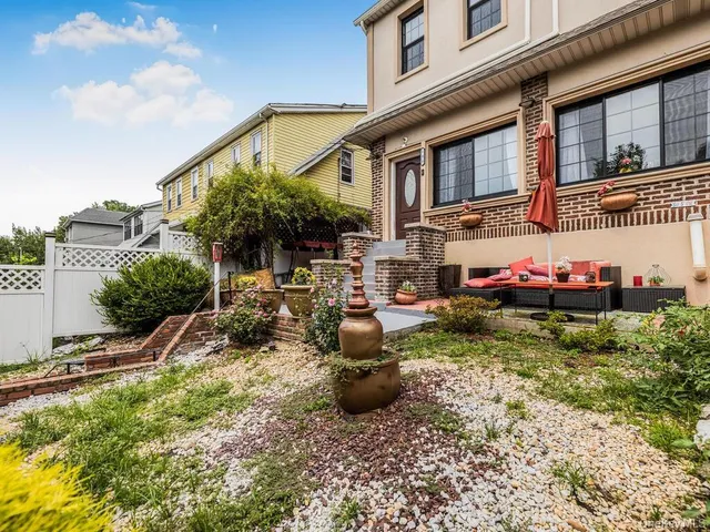 a view of a chair and tables in the patio