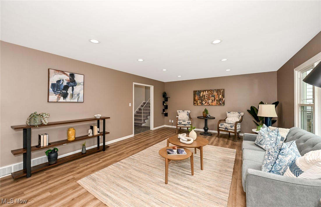 2015 Burlington Road Akron, OH 44313 - Photo 6 of 50 Living room featuring light wood-type flooring, stairs, recessed lighting, and baseboards