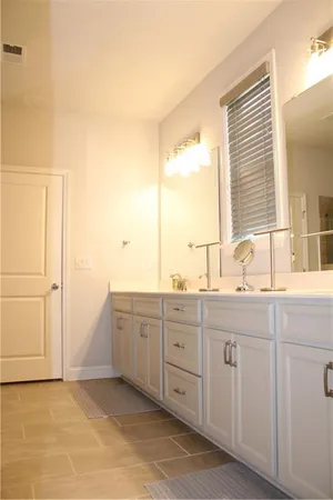 a bathroom with a sink and mirror