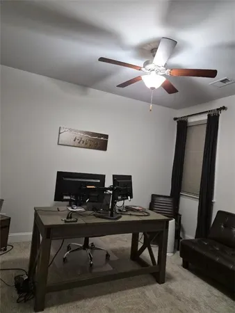 a view of a workspace with furniture