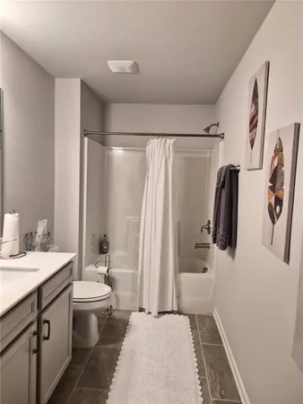 a view of a livingroom with furniture and staircase