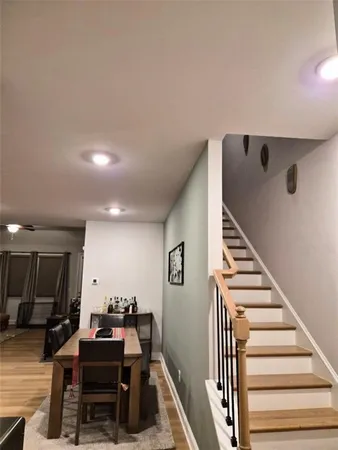 a view of a livingroom with furniture and staircase