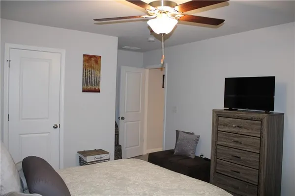 a bathroom with a sink a toilet and shower curtain