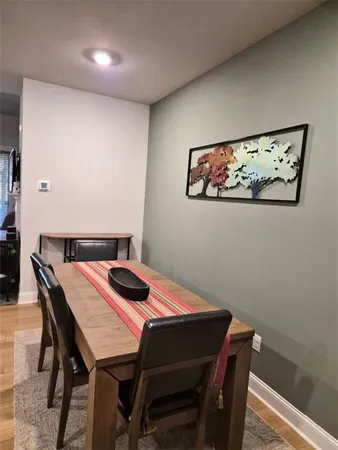 a living room with furniture and a ceiling fan