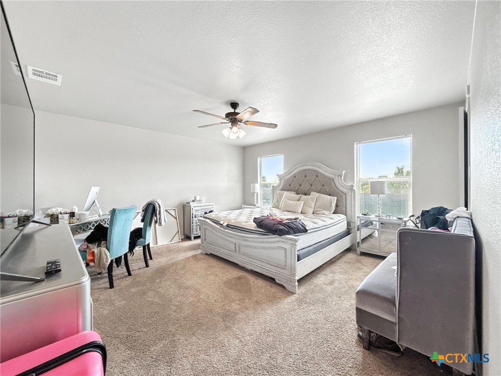 2701 Settlement Road Copperas Cove, TX 76522 - Photo 15 of 18 a living room with furniture and a chandelier