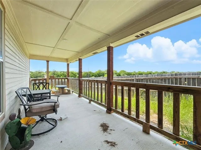 a balcony with furniture and city view