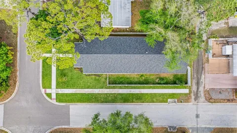 a view of a house with a backyard