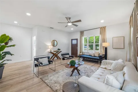 a living room with furniture and a window
