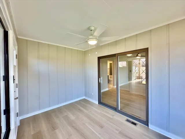 a view of an empty room with a window