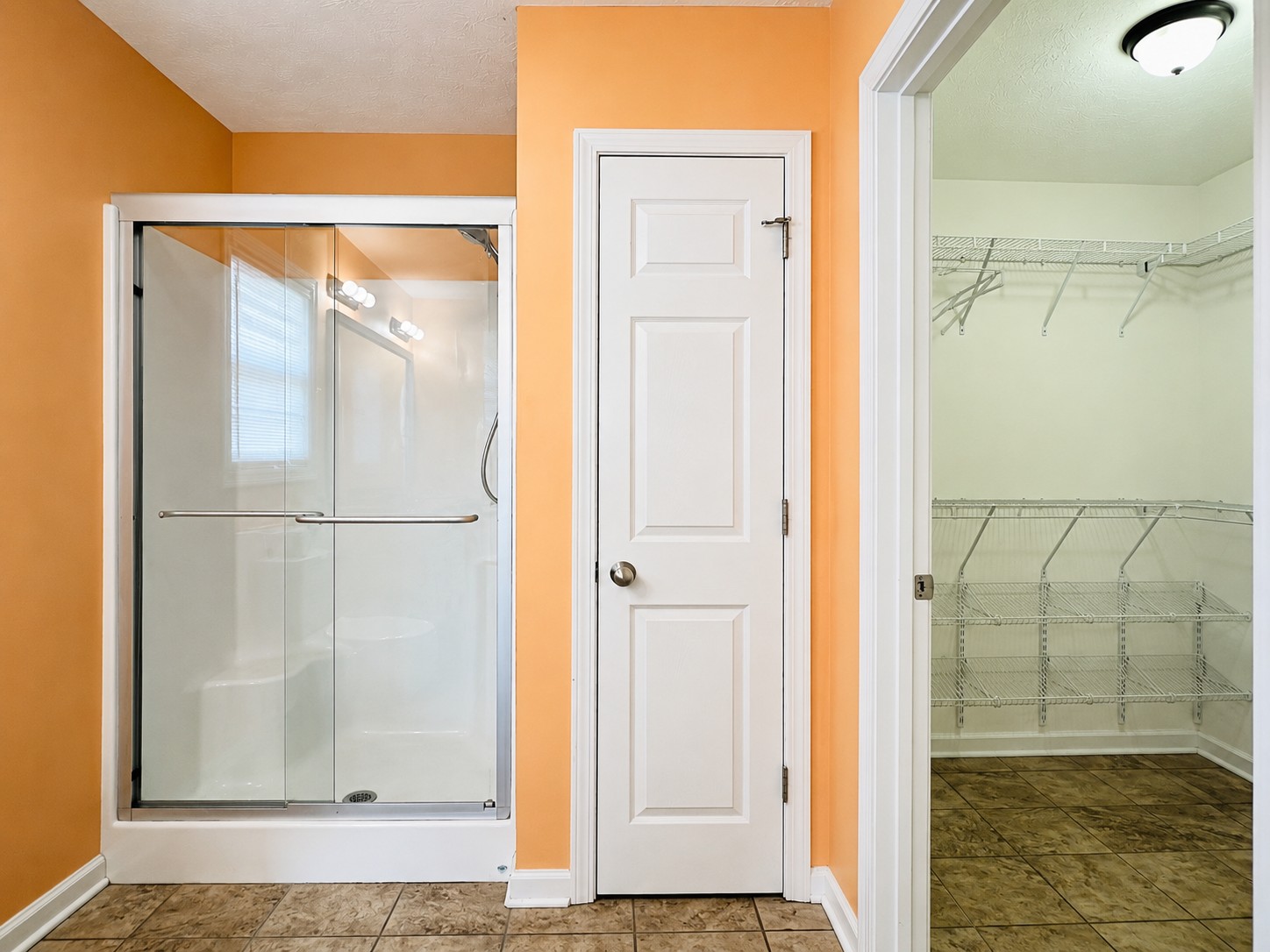 663 Jackson Road Portland, TN 37148 - Photo 20 of 32 a bathroom with a glass shower door