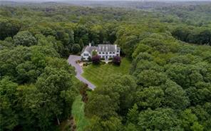 73 Dann Farm Road Pound Ridge, NY 10576 - Photo 1 of 1 an aerial view of a house with a yard
