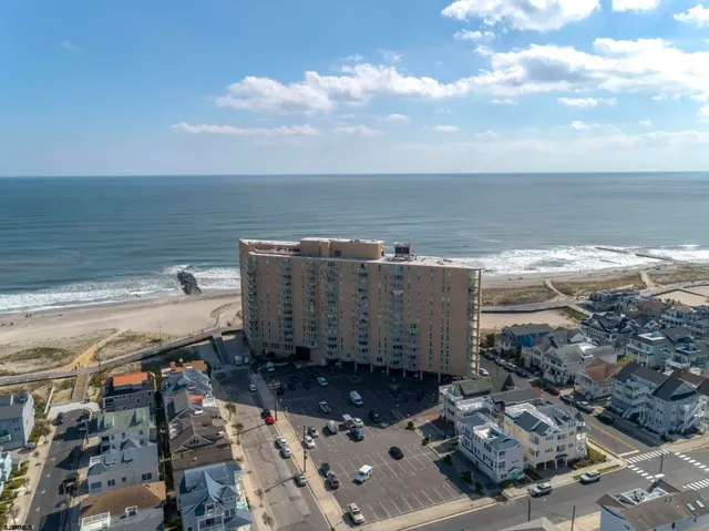 a view of a ocean view with beach and city view