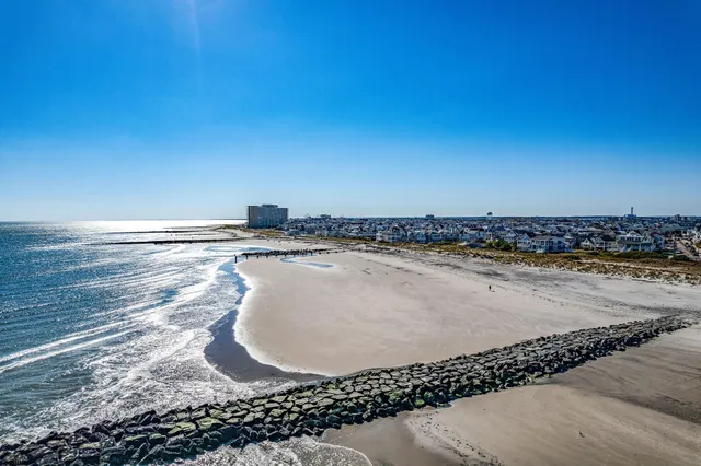 a workspace with furniture bookshelf and a window