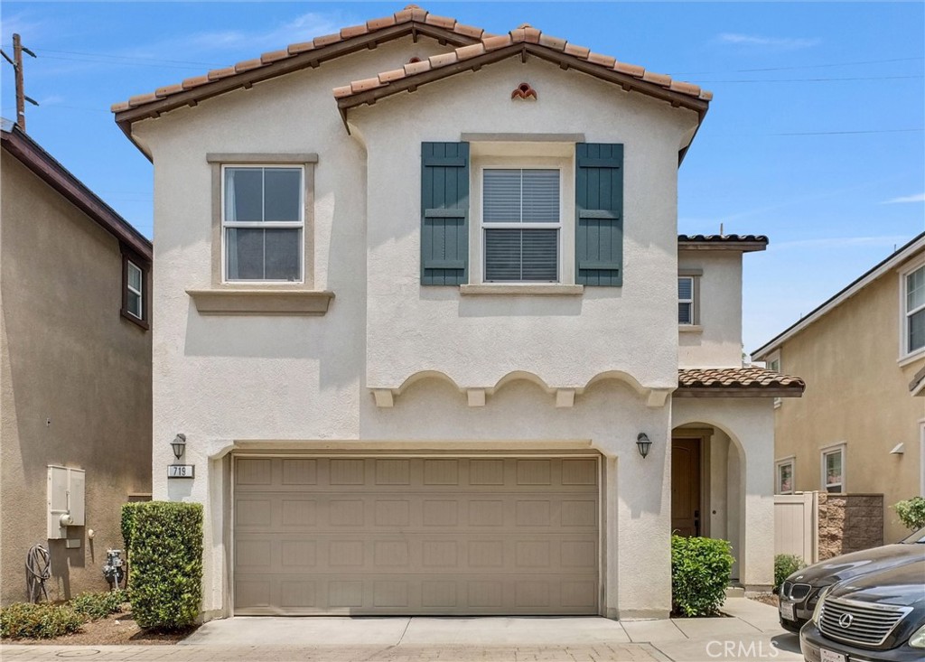 a front view of a house with large windows