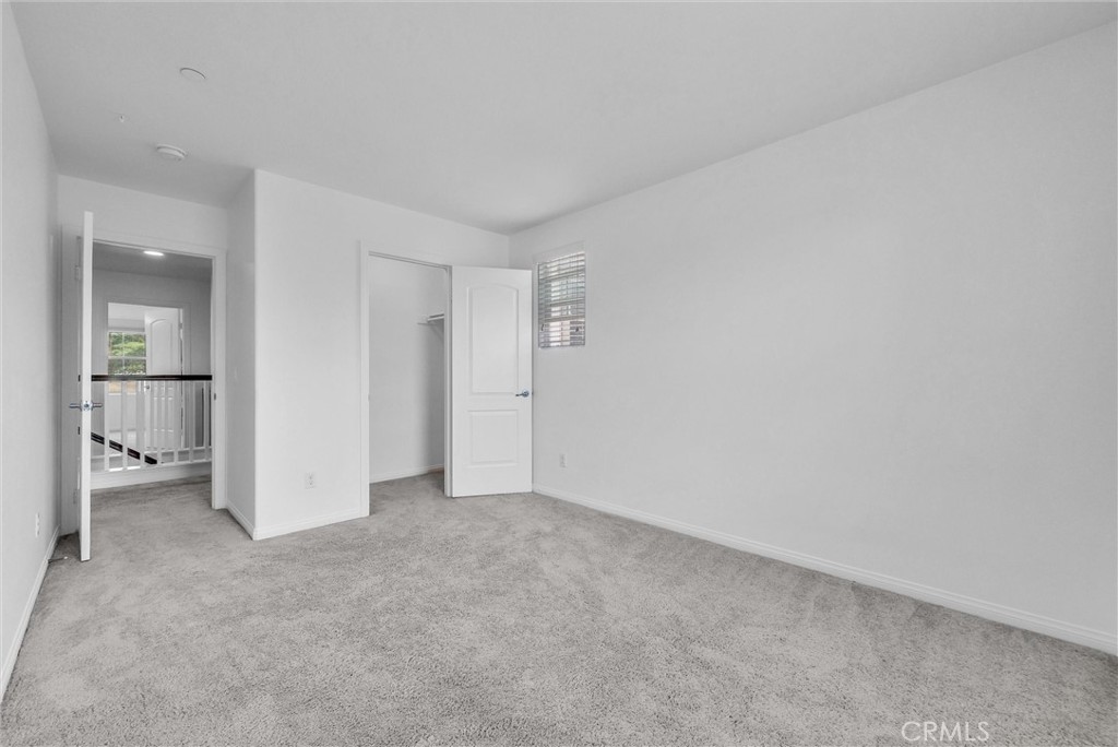 719 Huron Place Claremont, CA 91711 - Photo 16 of 37 an empty room with white cabinet and a bathroom