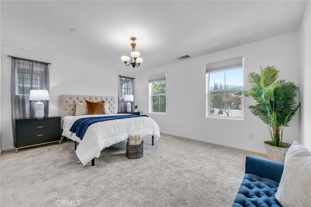 719 Huron Place Claremont, CA 91711 - Photo 21 of 37 a bed room with a bed and a potted plant