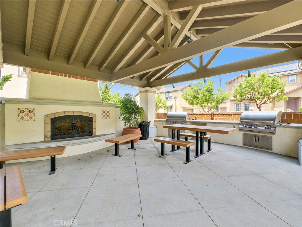 719 Huron Place Claremont, CA 91711 - Photo 31 of 37 a living room with furniture and a fireplace