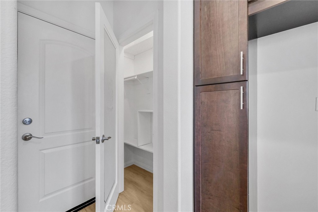 719 Huron Place Claremont, CA 91711 - Photo 10 of 37 a walk in closet with wooden racks