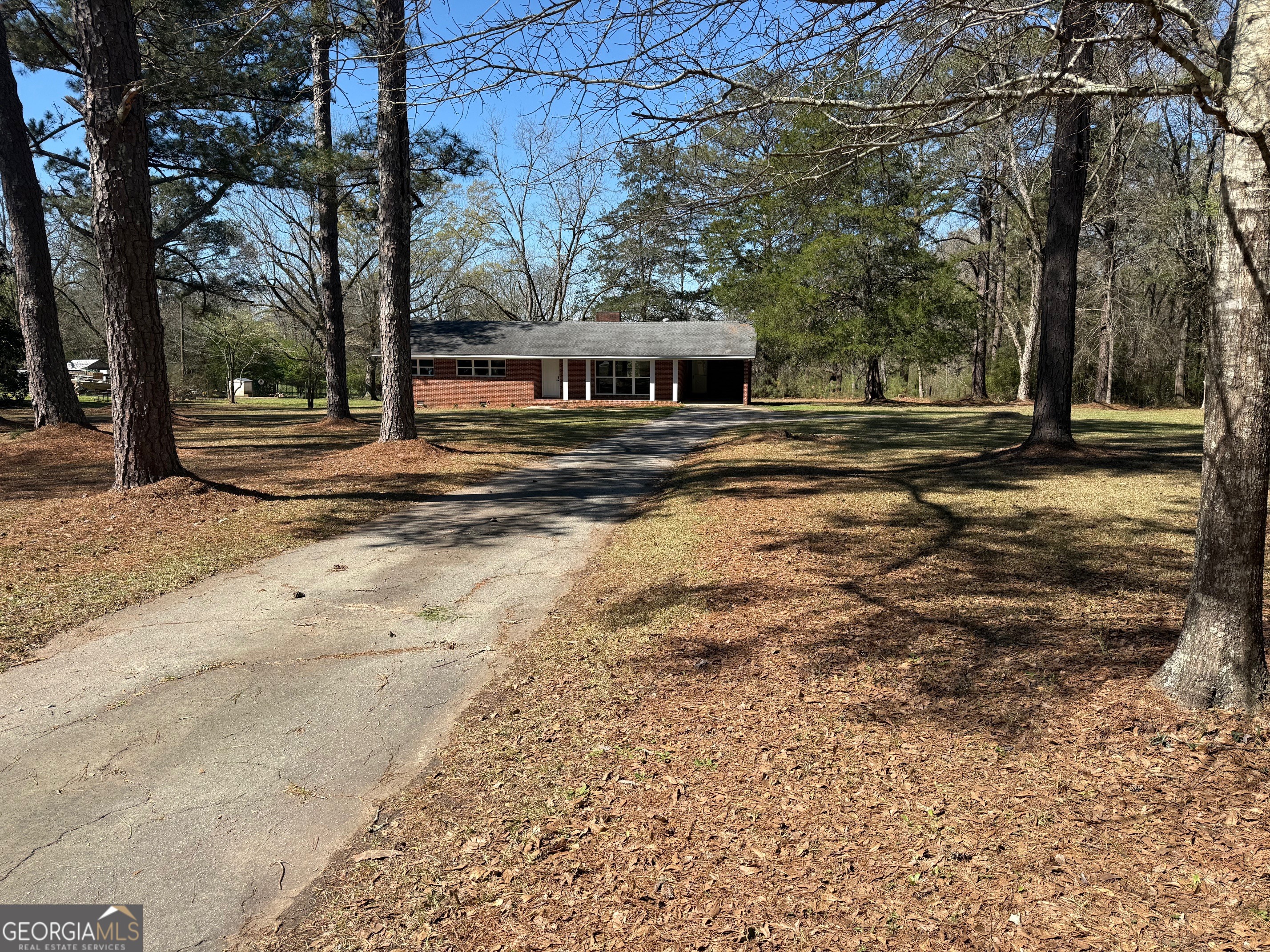 4005 Highway 85 Manchester, GA 31816 - Photo 2 of 41 a view of a yard with large trees