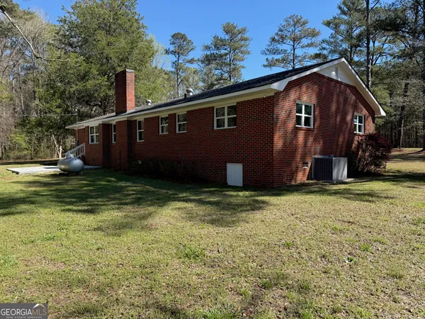 a view of swimming pool with a yard