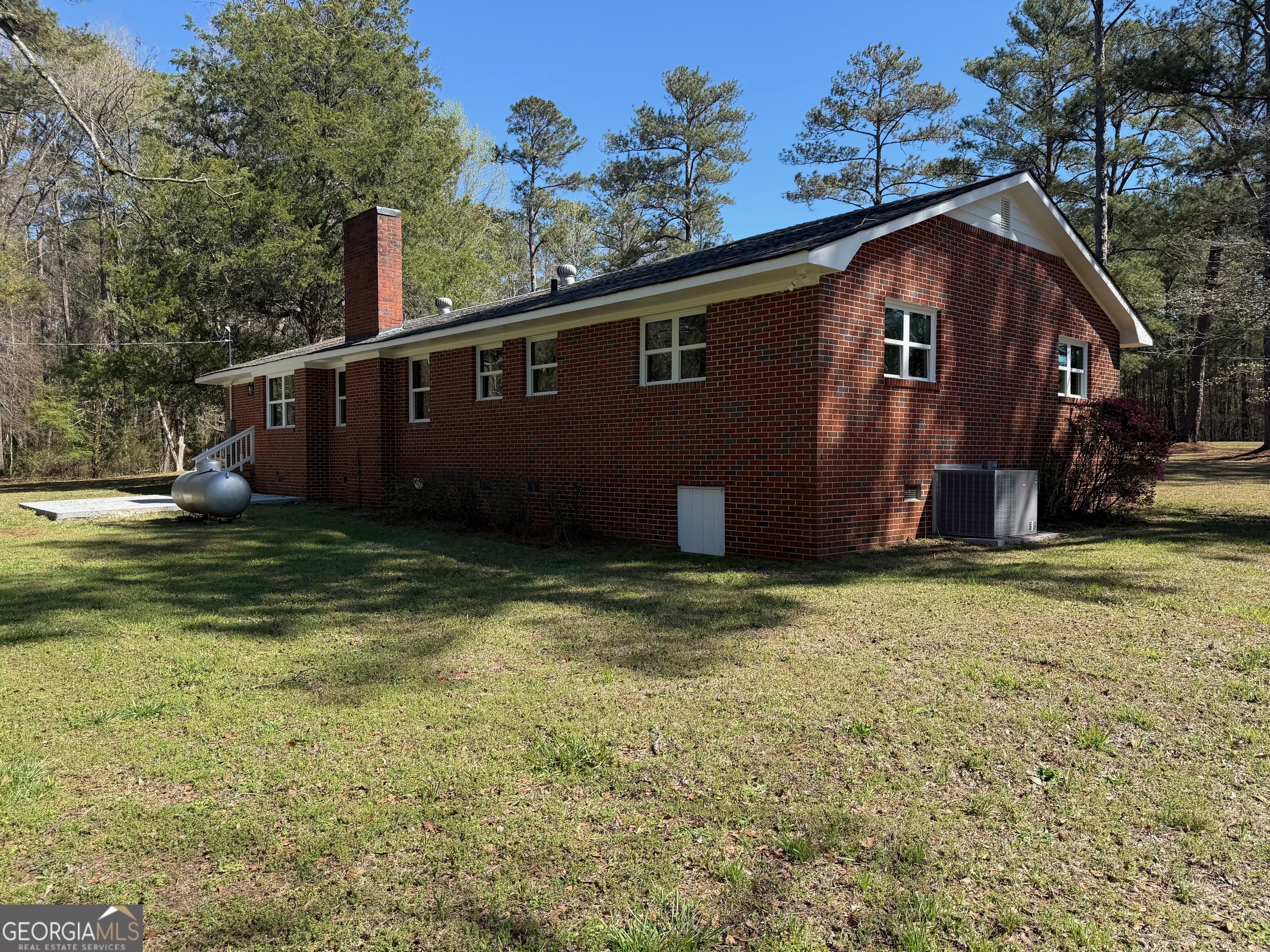 4005 Highway 85 Manchester, GA 31816 - Photo 33 of 41 a backyard of a house with lots of green space
