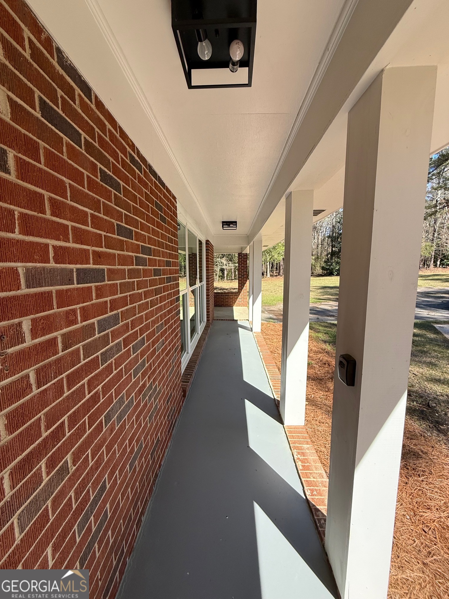 4005 Highway 85 Manchester, GA 31816 - Photo 35 of 41 a view of a hallway with wooden floor and staircase