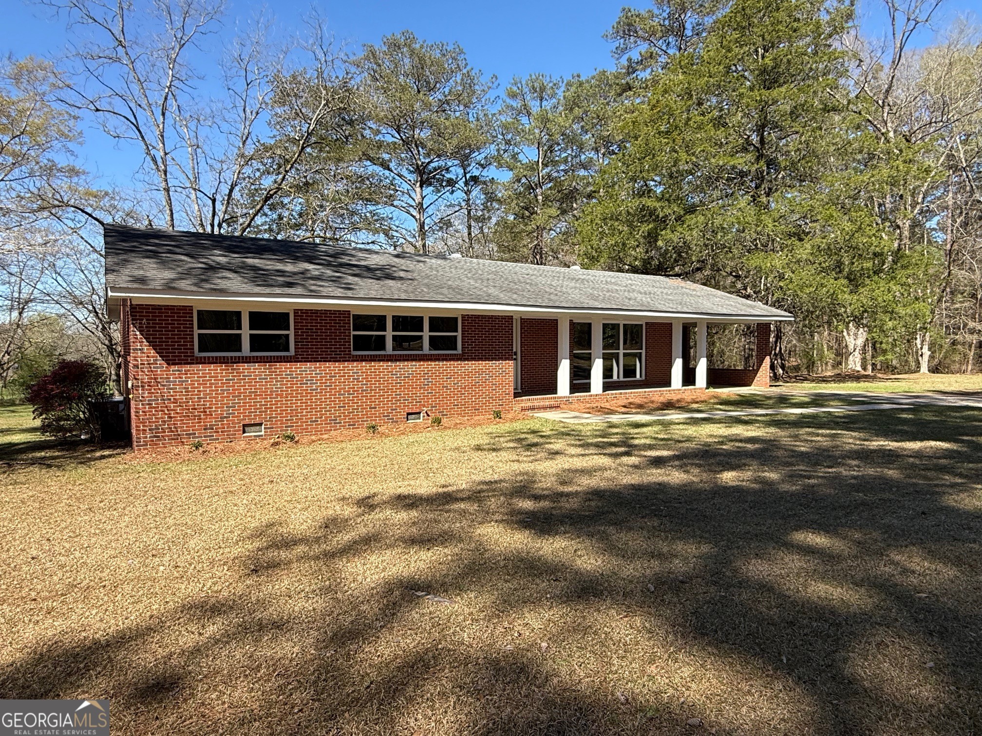 4005 Highway 85 Manchester, GA 31816 - Photo 36 of 41 a front view of a house with a yard