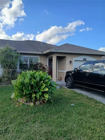 a house view with a garden space