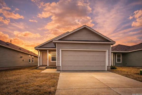 a front view of the house with garage