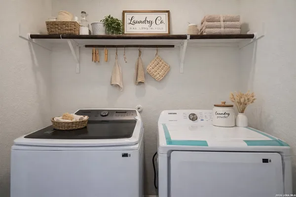 a utility room with dryer and washer