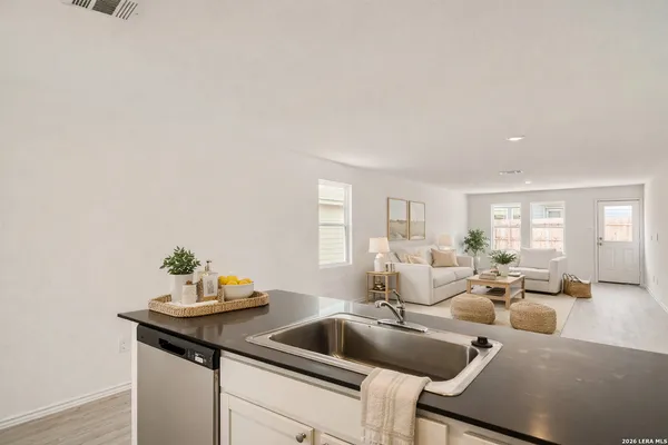 a living room with furniture and window
