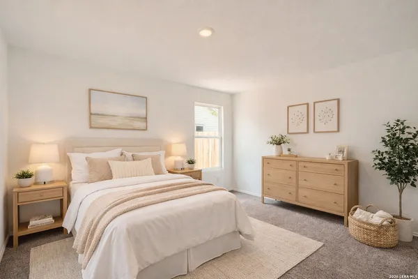 a bedroom with a bed and a dresser