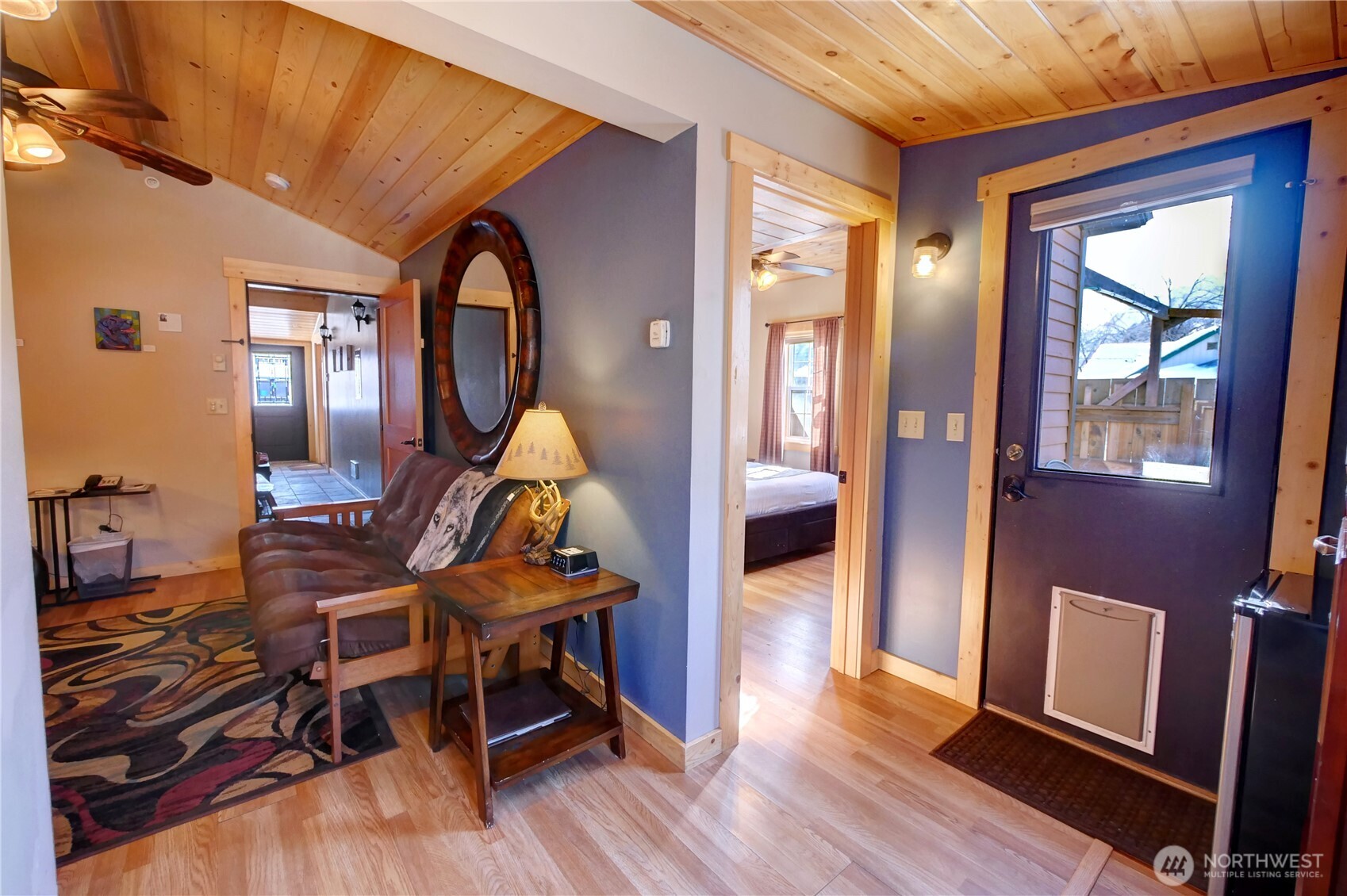 115 Johnson Street, Unit 1 2 3 Twisp, WA 98856 - Photo 20 of 40 a living room with furniture and wooden floor
