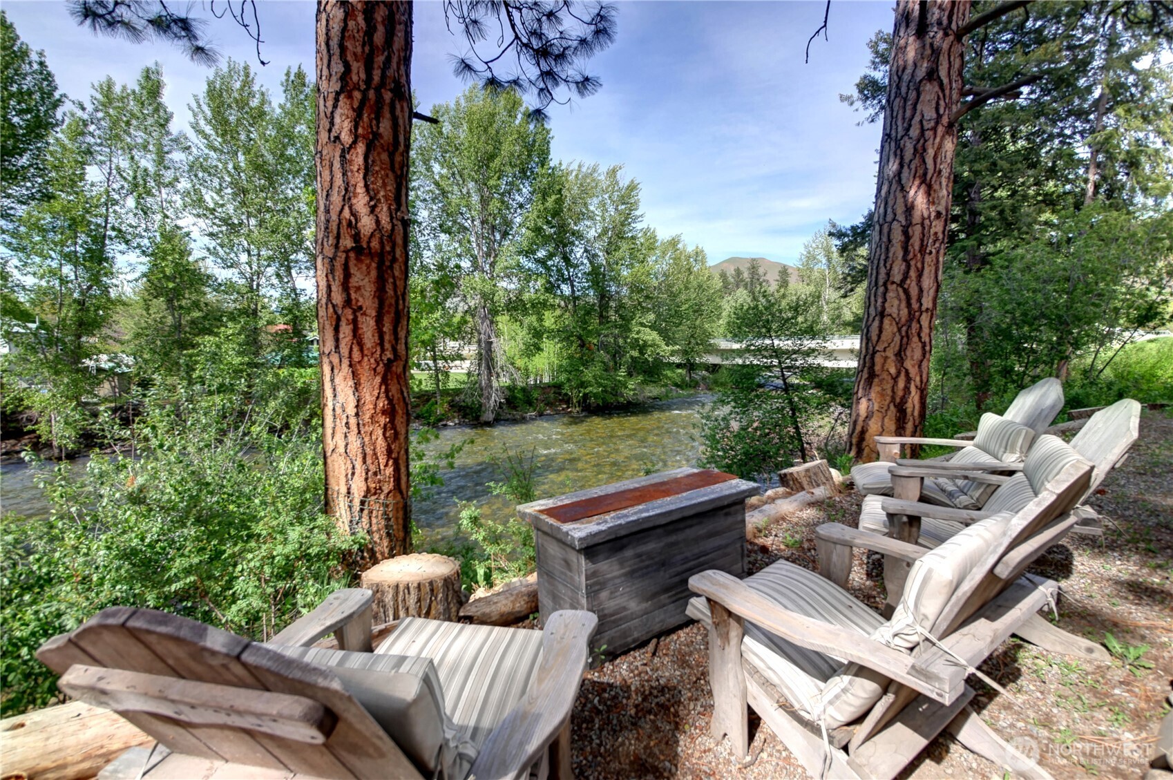 115 Johnson Street, Unit 1 2 3 Twisp, WA 98856 - Photo 2 of 40 a view of a patio with couches chairs and a table
