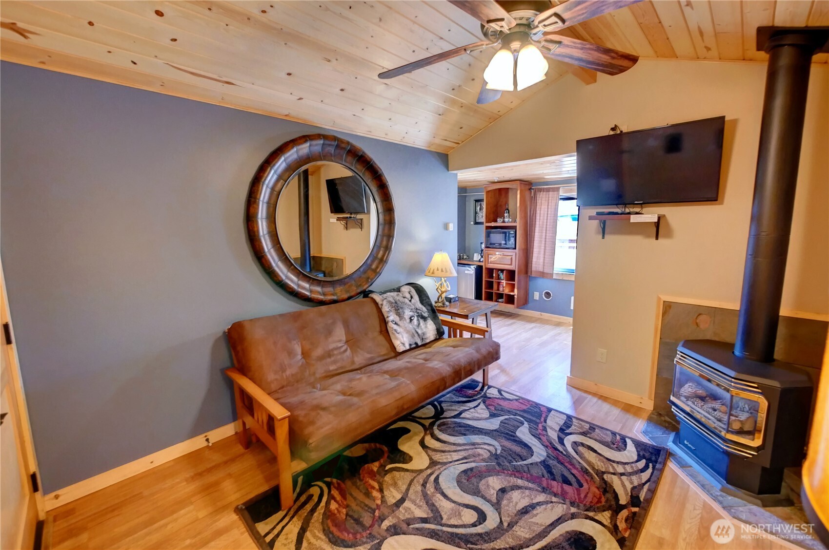 115 Johnson Street, Unit 1 2 3 Twisp, WA 98856 - Photo 21 of 40 a living room with furniture and a flat screen tv