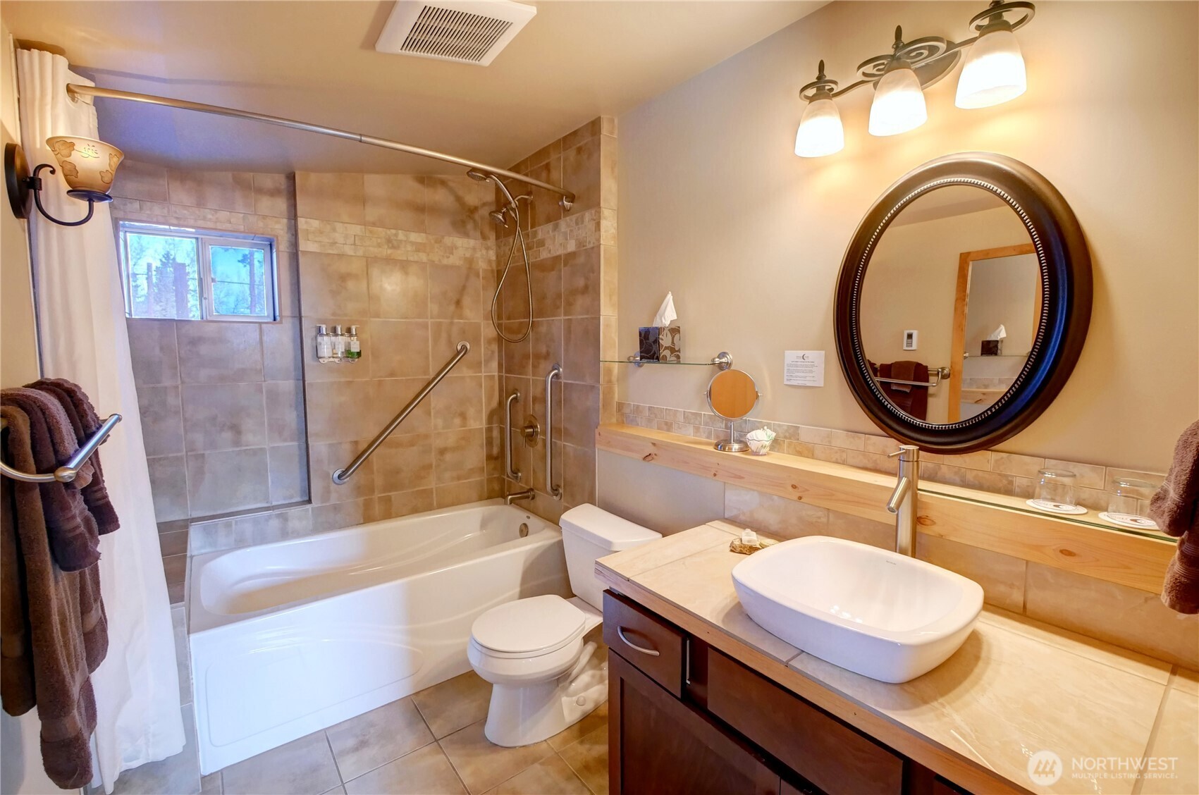 115 Johnson Street, Unit 1 2 3 Twisp, WA 98856 - Photo 24 of 40 a bathroom with a sink a toilet and shower