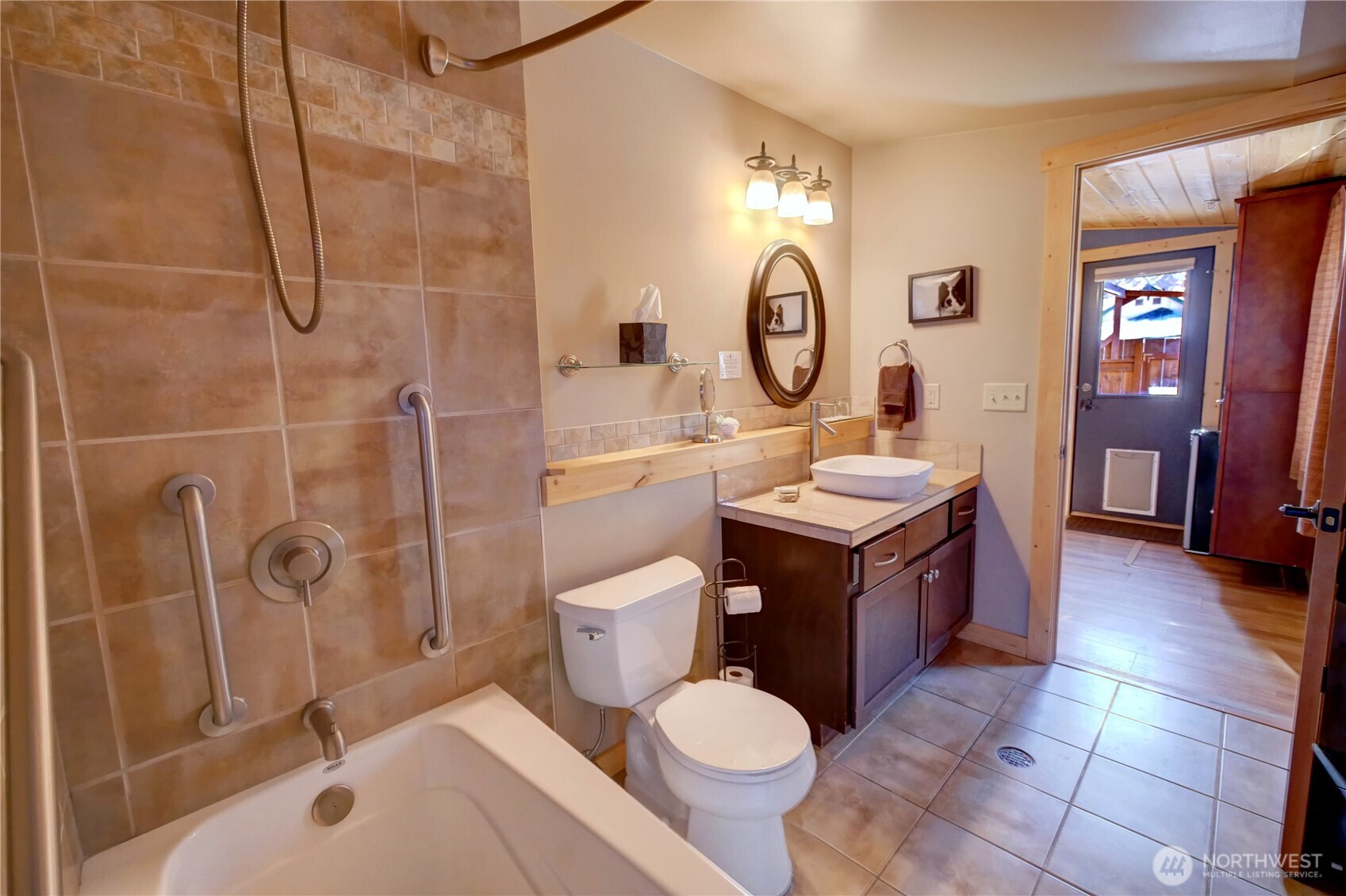 115 Johnson Street, Unit 1 2 3 Twisp, WA 98856 - Photo 25 of 40 a bathroom with a tub sink mirror vanity and toilet