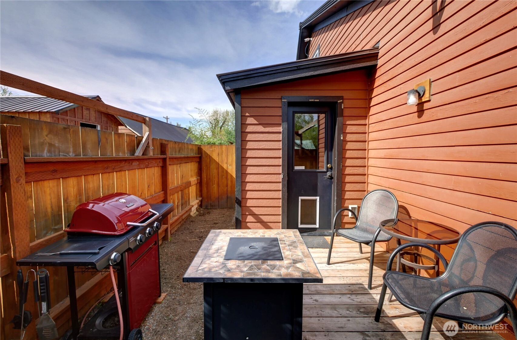 115 Johnson Street, Unit 1 2 3 Twisp, WA 98856 - Photo 27 of 40 a view of an outdoor sitting area with brick walls