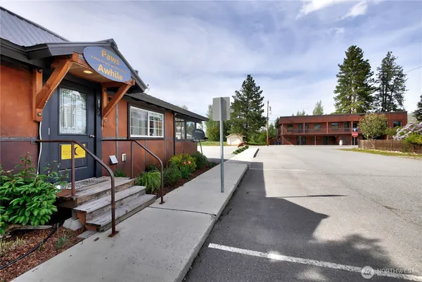 a view of house with outdoor space and sitting area