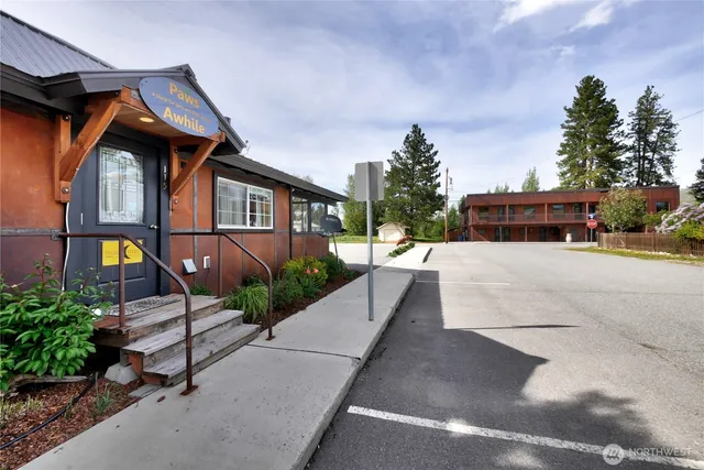 a view of house with outdoor space and sitting area