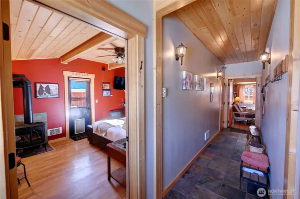 a view of hallway with livingroom and furniture